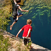 Boys Jumping into Jacob's Well